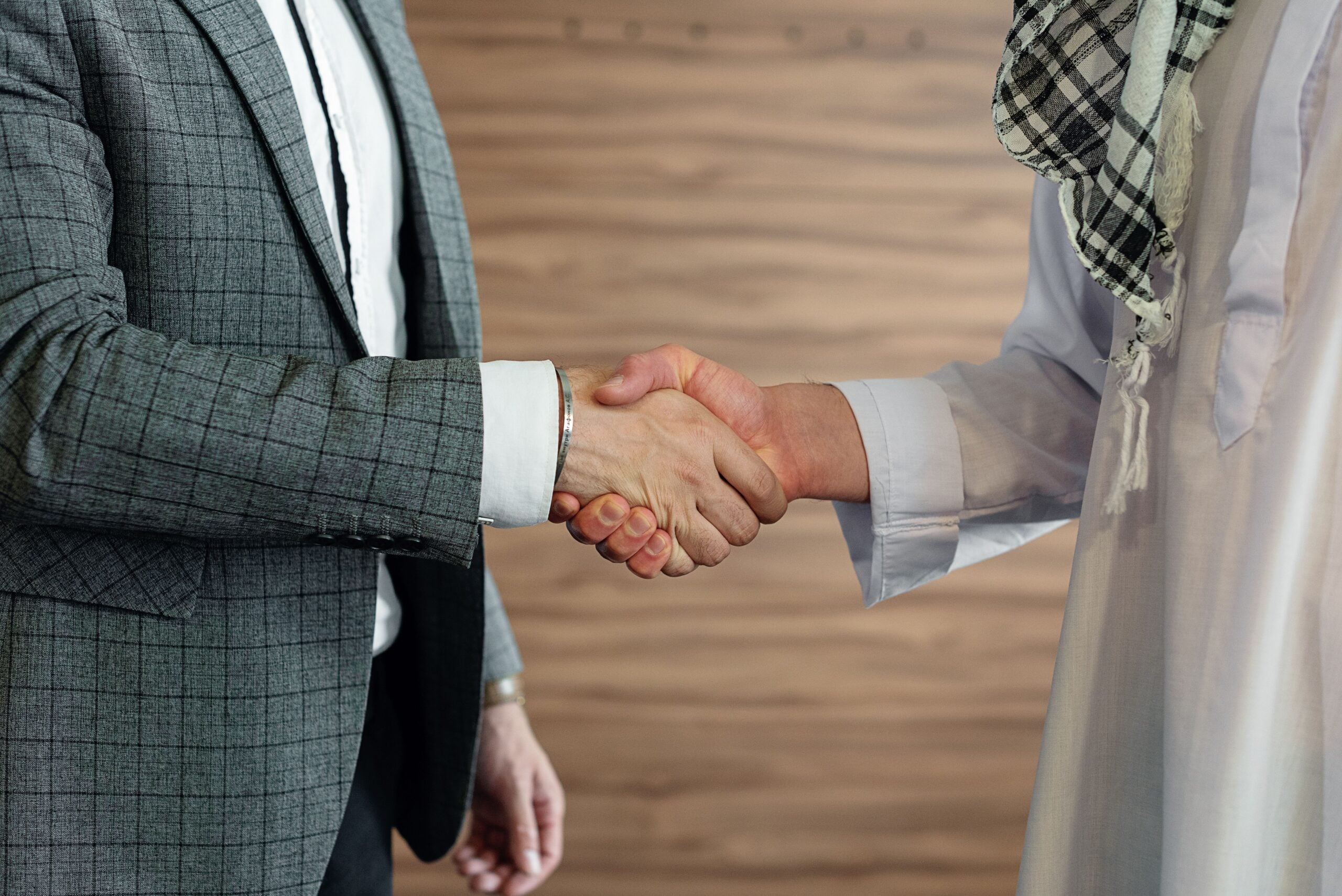 Business handshake representing a referral partnership
